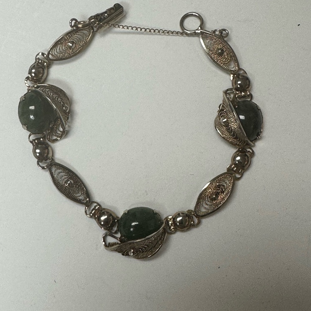 Elegant Gold Bracelet with Jade Stones